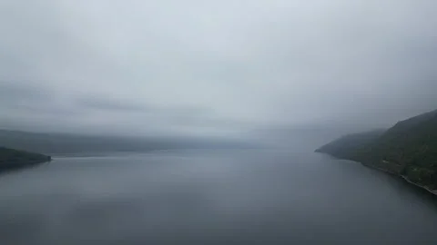 View Over Cloudy Loch Ness – 4K Drone Static Shot Stock Footage 319816177