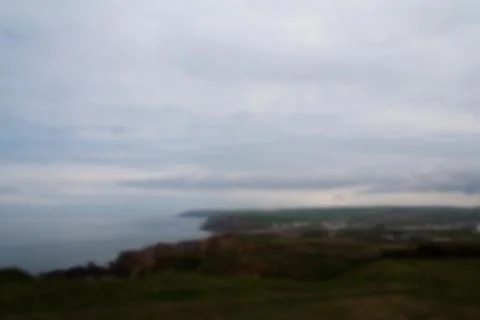 View over the coast near Bude in Cornwall Out of focus. Stock Photos