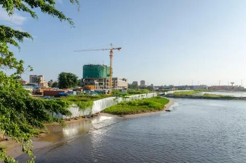View over construction site and container harbor at coast of Pointe-Noire Stock Photos