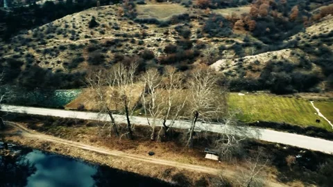 View over a dam trees next to it 스톡 동영상 230480275