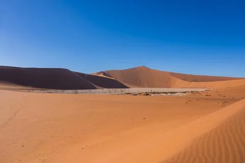 View over the Deadvlei basin from a dune slope in Namibia Stock Photos