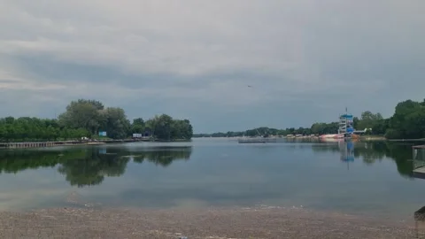 View over empty Ada Lake in Belgrade, Serbia, on a cloudy spring day Stock Footage 334352132