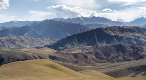 View over eroded mountainous landscape with brown dry hills Konorchek Canyon 스톡 사진