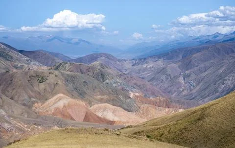 View over eroded mountainous landscape of Konorchek Canyon with red sandstone Stock Photos