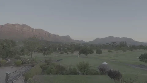 View over Golf Course and Mountains in Stellenbosch at Sunset | S-LOG Stock Footage 307419811