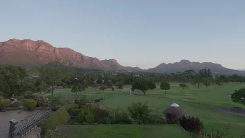 View over Golf Course and Mountains in Stellenbosch at Sunset | Rec. 709 Video stock 308462601