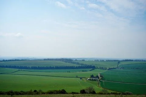 View over green farm fields in the south of England Stock Photos