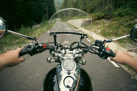 The view over the handlebars of motorcycle Stock Photos