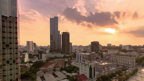 View over Ho Chi Minh Sunset Sun Wah Tower Day to Night Pan timelapse Stock Footage 144737346