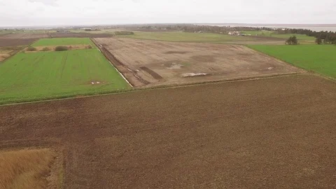 View over inlet with fields in the foreground Stock Footage 90805310