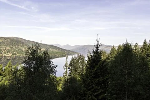 View over Loch Katrine to the  distant Arrochar hills, Highlands of Scotland. Stock Photos