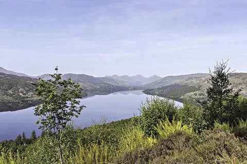 View over Loch Katrine to the  distant Arrochar hills. Scottish Highlands. Stock Photos