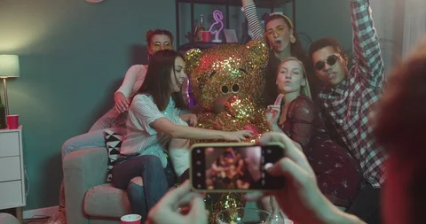 View over the male shoulder while taking photo with smarphone camera of the Stock Footage 122511716