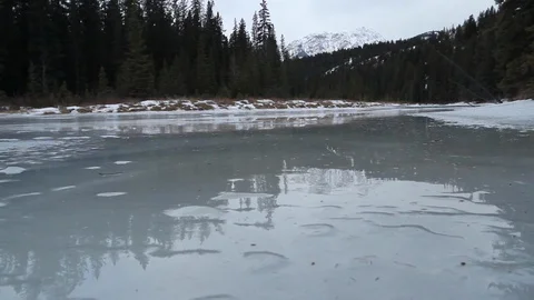View over a melting river in Alberta Stock Footage 90828880