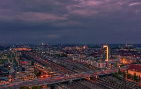 View over Munich at rush hour at the Donnersberger bridge with lights of cars in Stock Photos