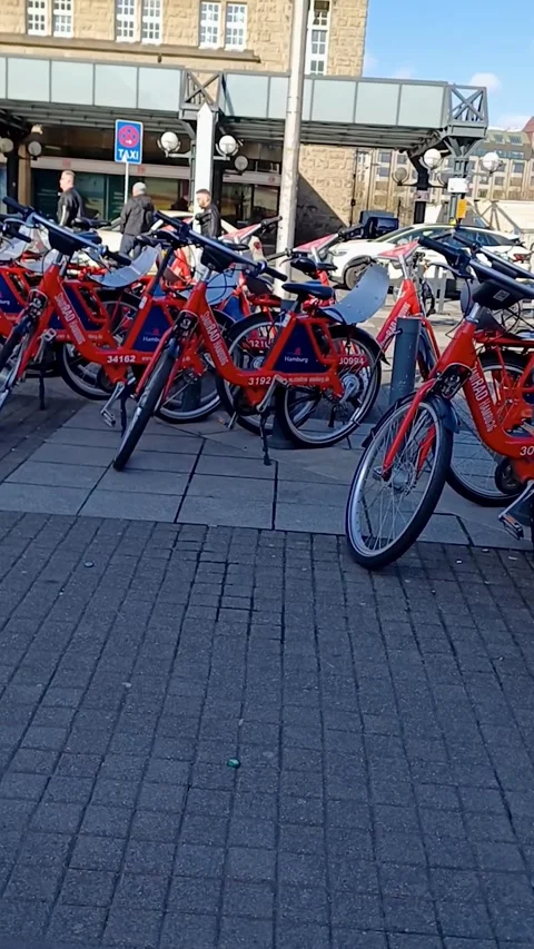 View over parked bicycles in front of main train station in Hamburg. Stock Footage 247152494