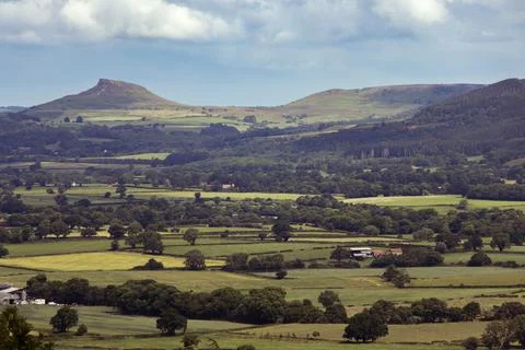 View over patchwork fields in North York Moors with clouds 스톡 사진