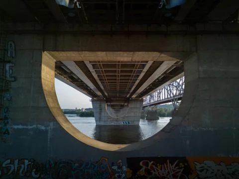 View over the river from under the bridge on the left bank of the Dnipro rive Stock Photos