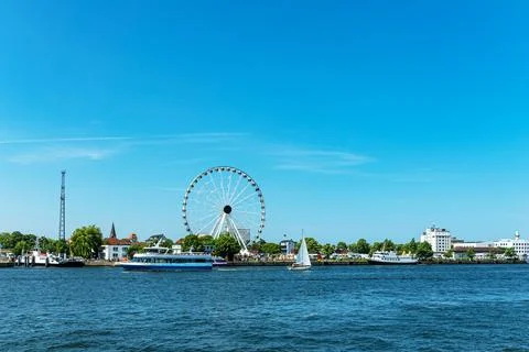 View over the river Warnow with ferris wheel in Warnemuende, Germany Stock Photos