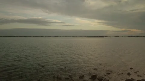View over rocks in foreground and bay water looking south west from Turtle Crawl Stock Footage 262561558