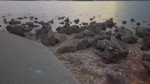 View over rocks in foreground and bay water looking south west from Turtle Crawl Stock Footage 262566386