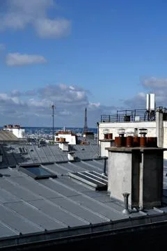 View over the roofs in Paris with Eiffel Tower in the background Fotos Stock