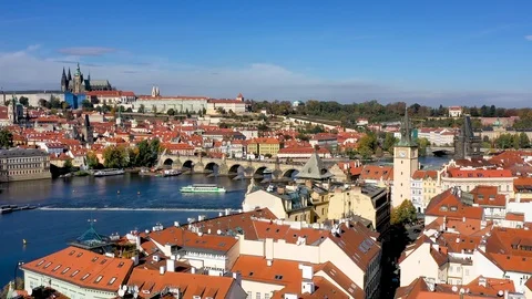 View over the rooftops to the famous Charles Bridge in Prague, Czech Republic Video stock 124066339