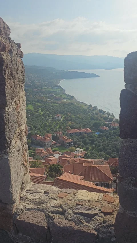 View over rooftops from Molyvos Castle wall, Molyvos, Greece Vertical 4K Video stock 348263014
