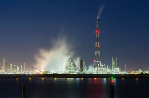 View over the Scheldt river in Antwerp, Belgium to a large oil refinery with  Stock Photos