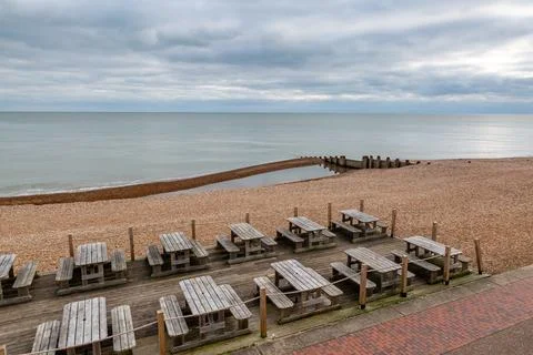 A view over the seafront at Eastbourne, with empty tables during low season Stock Photos
