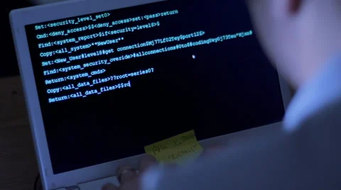 View over the shoulder of computer hacker Stock Footage 32423668