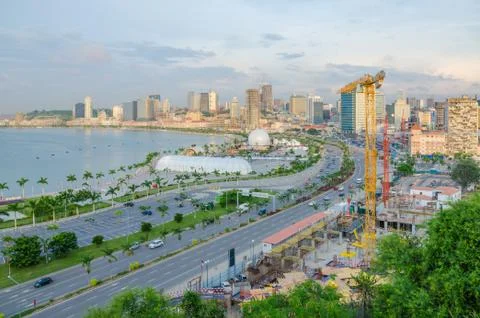 View over the skyline of Luanda with constructions cranes, highway and the Foto stock