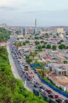 View over slums of Luanda with infamous traffic jams and Mausoleum of Agostinho Stock Photos