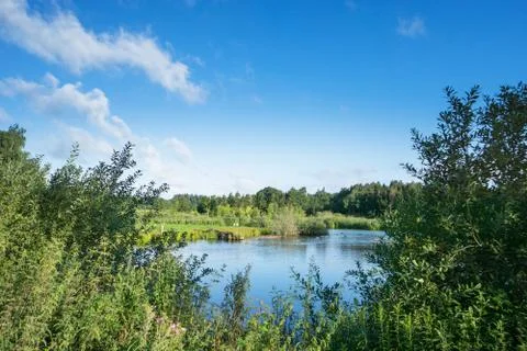 View over a small lake Stock Photos