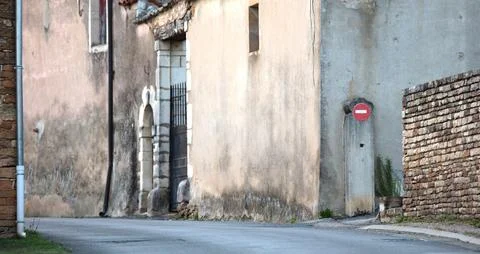 View over a small road through a French village Stock Photos