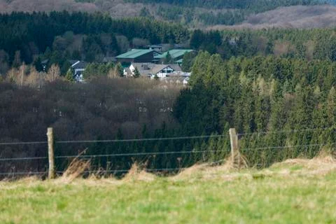 View over the southern Eifel hills near Daun, Germany to a large hotel comple Stock Photos
