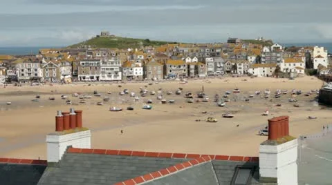 View over st ives harbour and beach with fishing boats on the sand at low tide Stock Footage 12094571