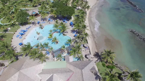 View over swimming pool and beach resort in Malta Stock Footage 66338424