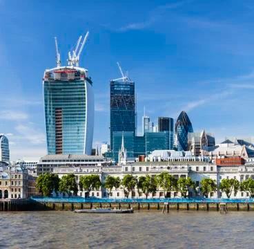 View over the Thames River in London to the city with several new skyscrapers Stock Photos
