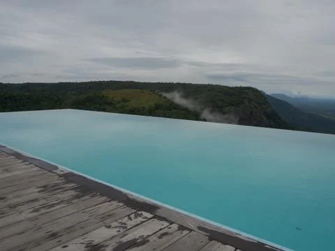View over Thekkady from the infinity pool of the Hills and Hues resort Stock Photos