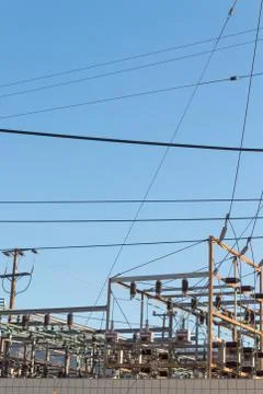 View over a wall of a power sub station on a cloudless day, copy space Stock Photos