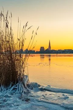 View over the Warnow River in winter at sunrise in Rostock, Germany Stock Photos
