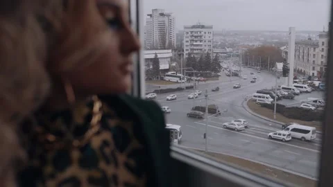 The view over the window is accentuated, in contrast to the smiling make-up Stock Footage 157682551