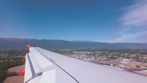 View over wing as aircraft comes into land at Geneva Airport, Switzerland Stock Footage 287482946