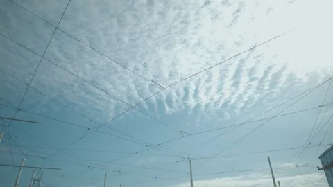 View of overhead train cables against blue sky. Stock Footage 300741786