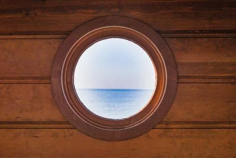 View of the Pacific ocean through a round window Foto stock