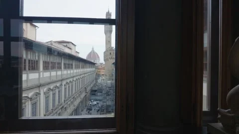 View of Palazzo Vecchio and Florence Cathedral Through Uffizi Gallery Window Stockbeeldmateriaal 340747660