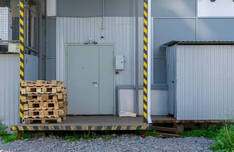 View on pallets, boxes in front of the door of the warehouse or store Stock Photos