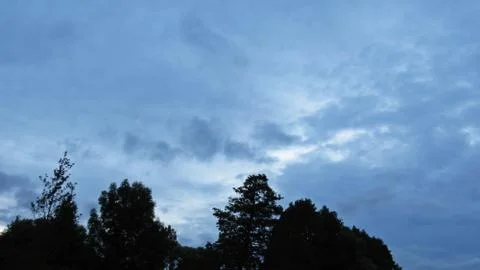 View at Panorama of Dark Storm Clouds on the Sky with Trees Stock Photos
