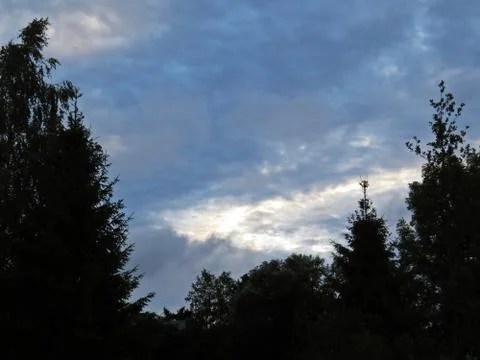 View at Panorama of Dark Storm Clouds on the Sky with Trees Stock Photos